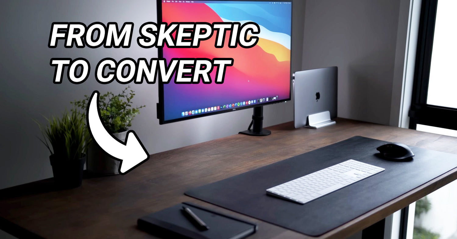 An image of a modern office desk with the text "From skeptic to convert", showcasing a clean desk and electronic devices.