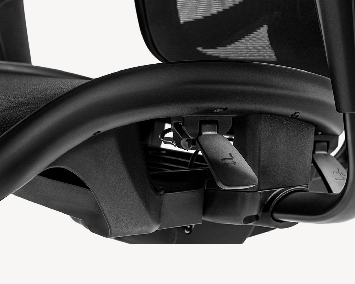 Underneath view of a Flujo ergonomic chair showcasing the Adjust Control Panel for personalized seating.