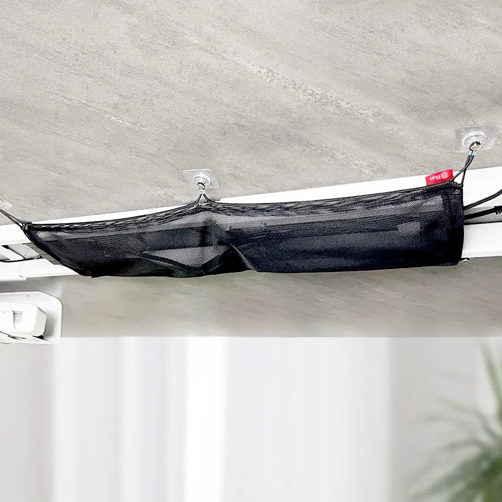 Mounted under desk cable management net in use, showcasing a neat solution for office spaces in Singapore.