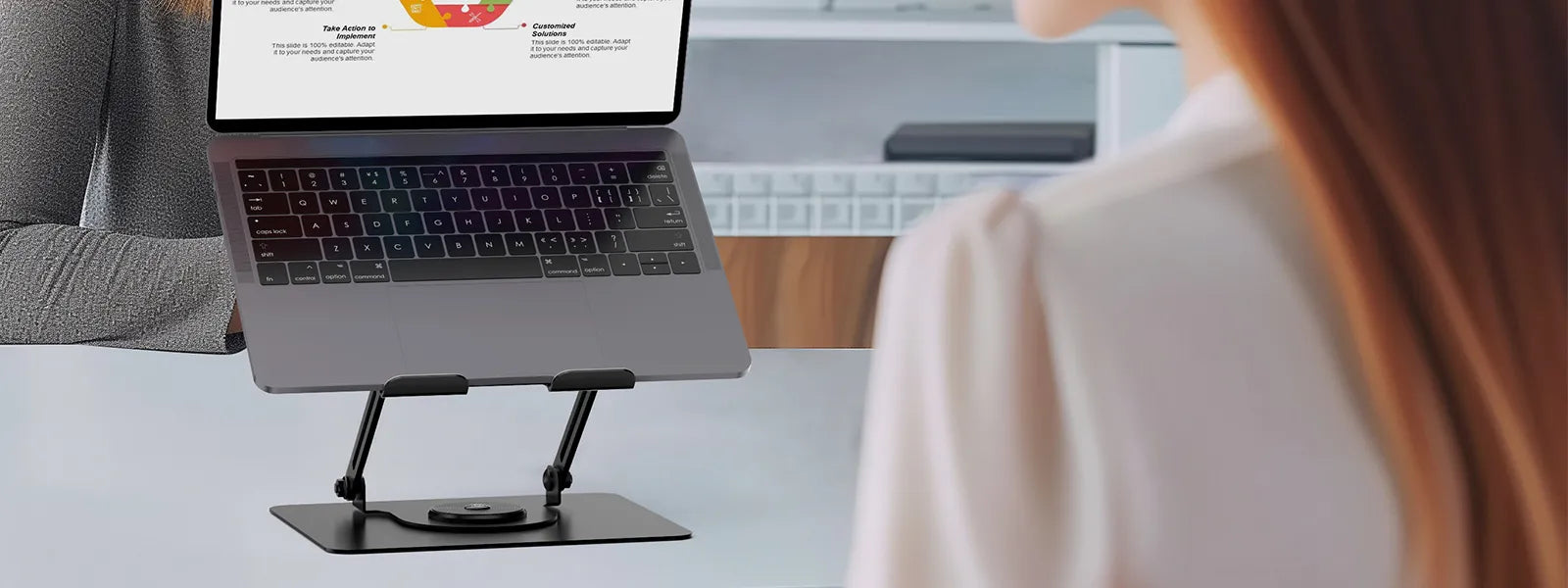 FlexStand Pro Laptop Stand by Flujo in a work setup with a laptop