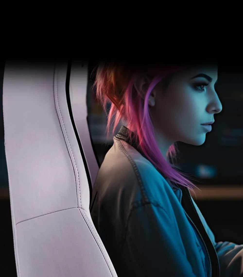 Female gamer sitting in a white SYCLONE PRO gaming chair, enhancing the gaming experience.