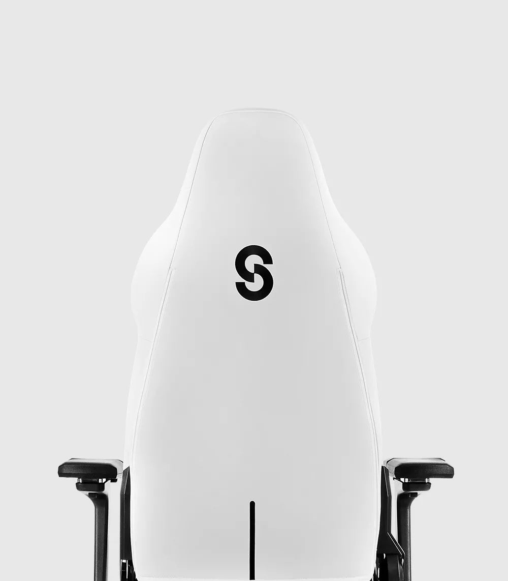 Back view of the white SYCLONE PRO gaming chair with a black 'S' logo.