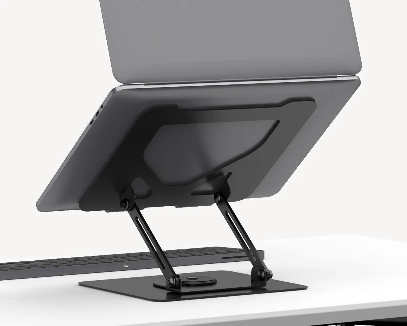 FlexStand Pro Laptop Stand by Flujo supporting a laptop