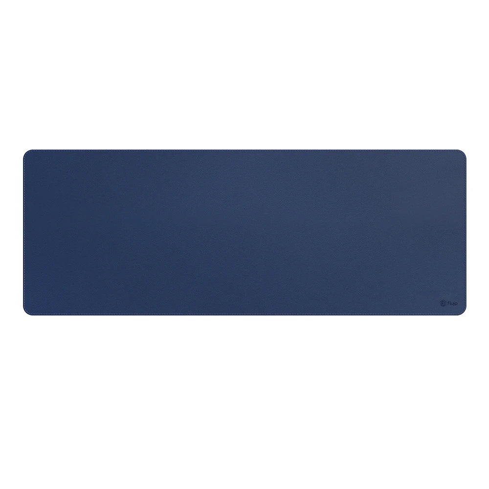 Navy blue desk mat with a subtle Flujo logo in the bottom right corner, offering a large, smooth surface for comfortable writing and mouse usage