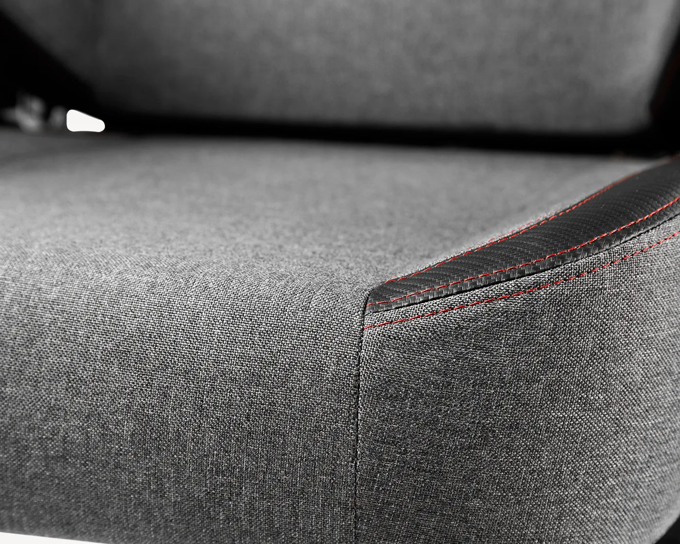 Detail of linen fabric on a grey gaming chair offering better breathability and reduced wear and tear, by TRITON.