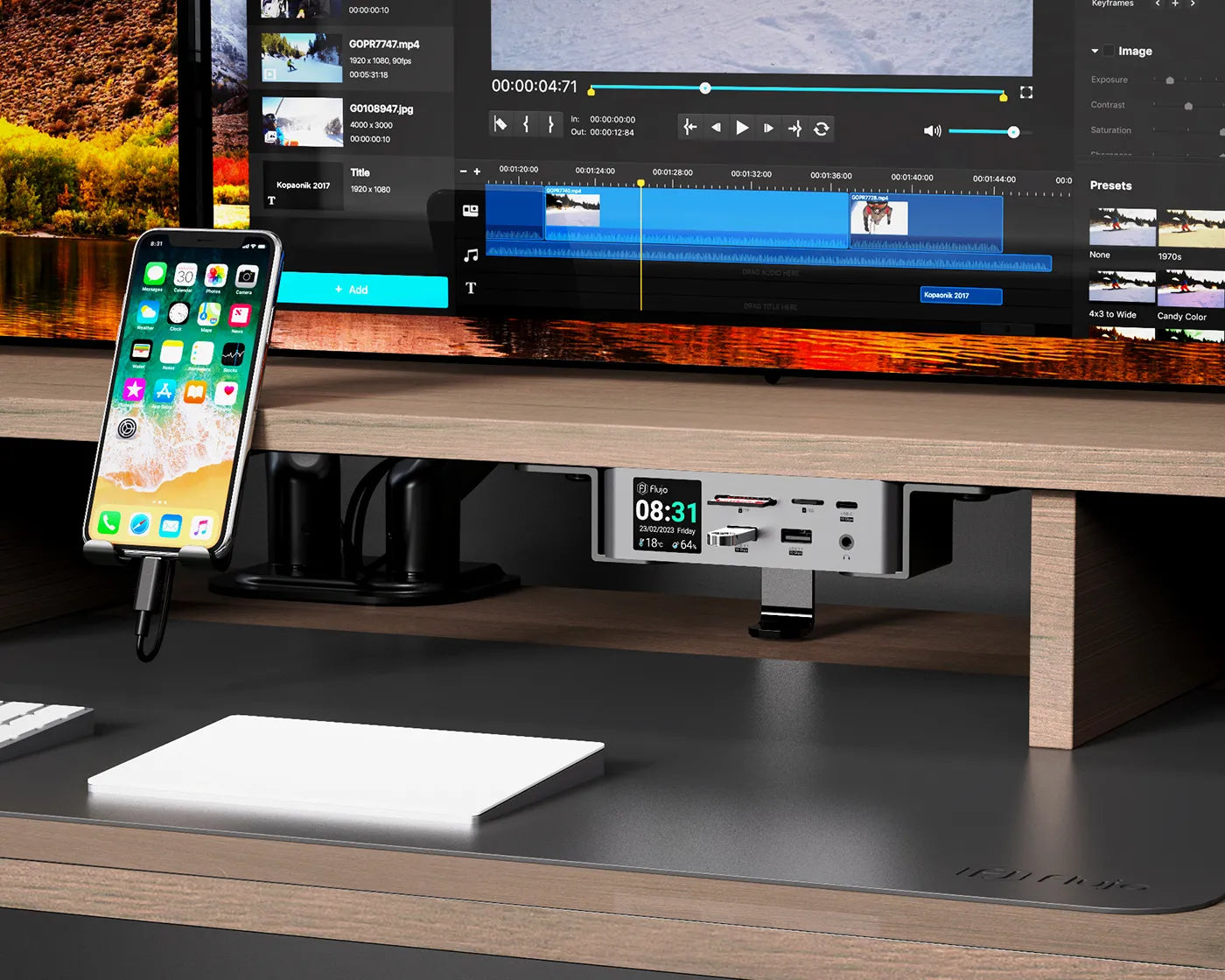 A workspace setup featuring a monitor riser with modular accessories including a phone stand and additional storage solutions.