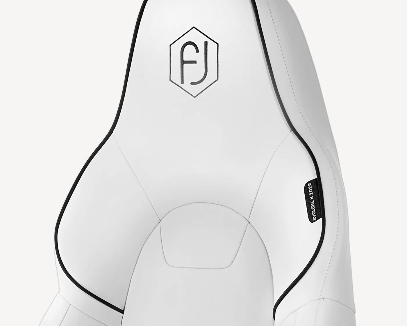 Detail of white ergonomic chair's silicone leather material emphasizing eco-friendly design.