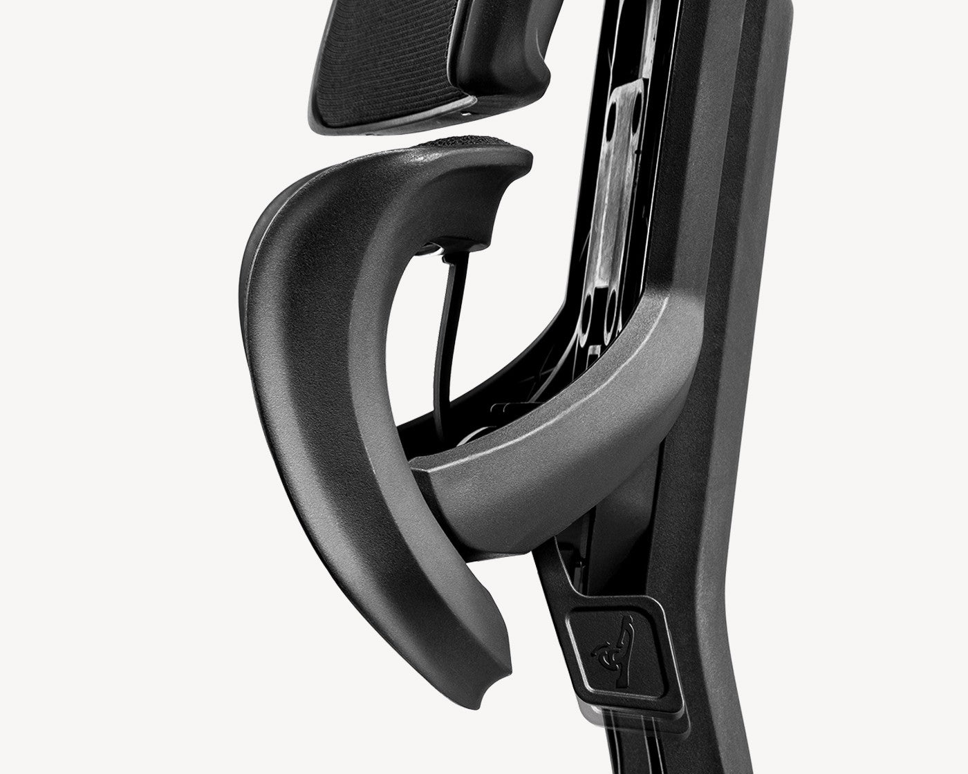 Underneath view of a Flujo ergonomic chair showcasing the Adjust Control Panel for personalized seating.