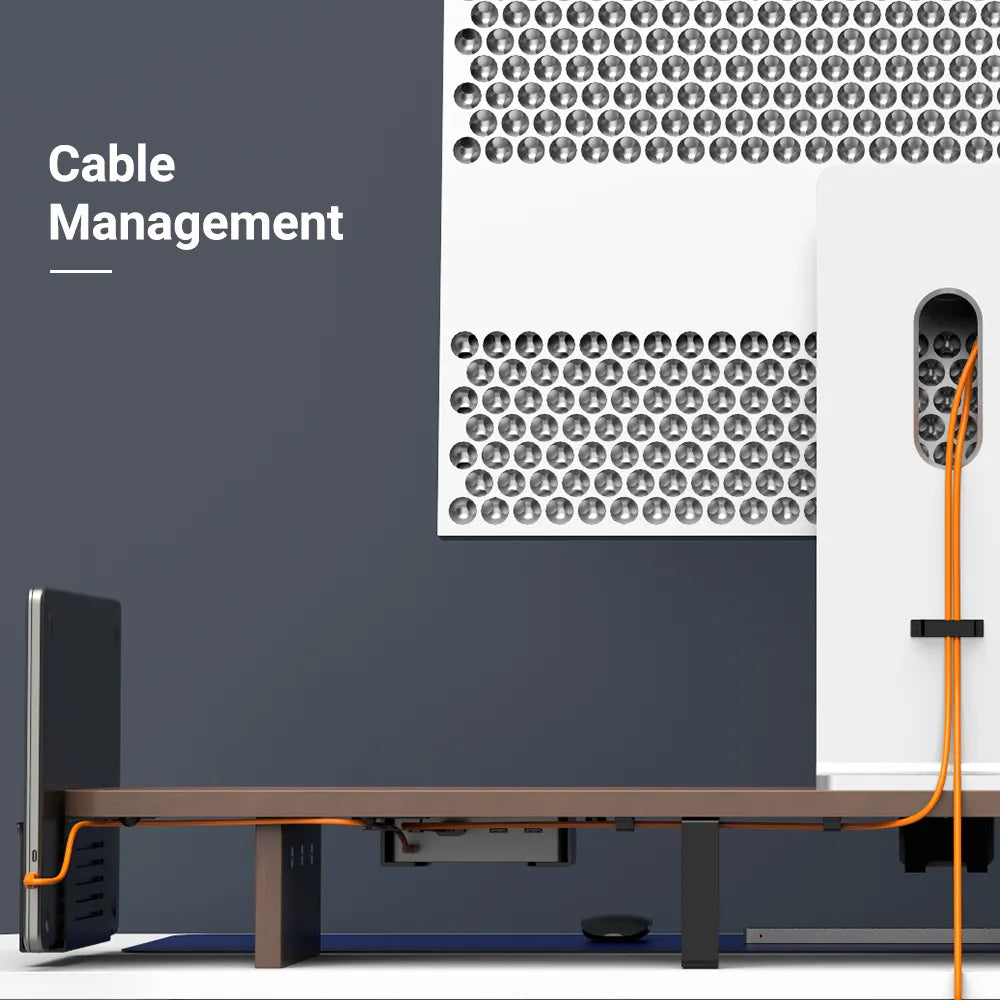 Efficient cable management system under a wooden monitor riser, creating a tidy and functional desk setup in Singapore.