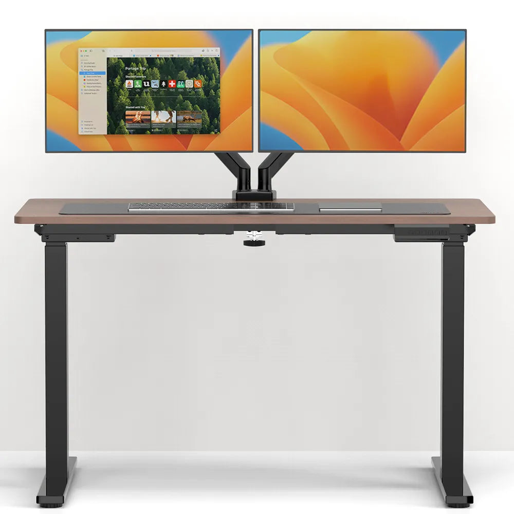 Modern dual-monitor setup on an ergonomic desk in Singapore, featuring adjustable arms for optimal screen positioning.