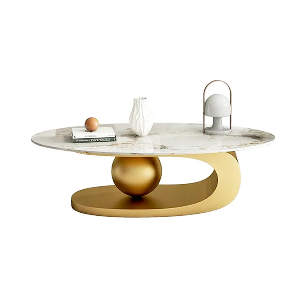 Elara oval-shaped modern coffee table featuring a glossy white top and a sculptural gold metallic base with a central sphere design
