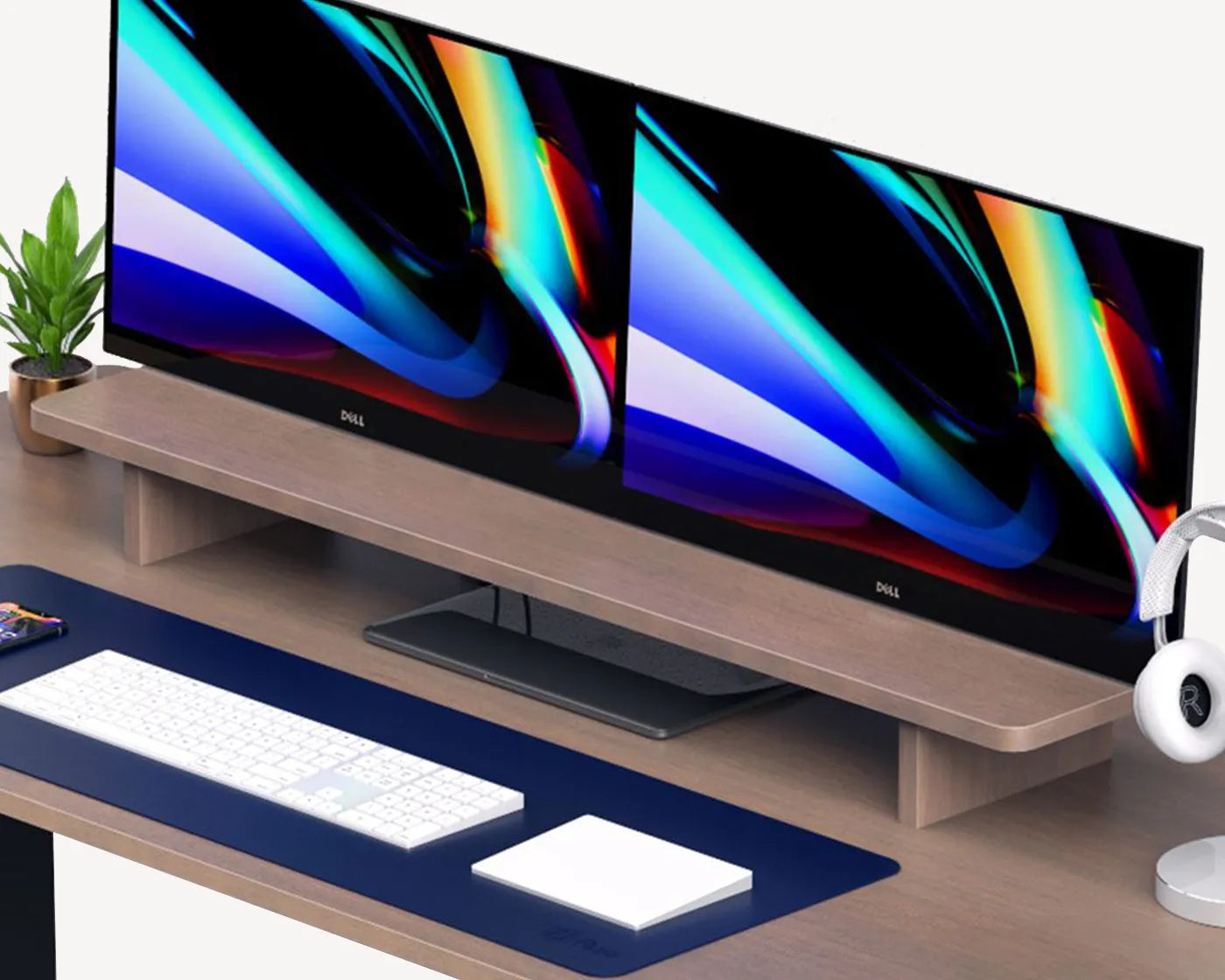 A space-saving ergonomic monitor riser on a tidy desk, demonstrating how it minimizes footprint while organizing desktop accessories