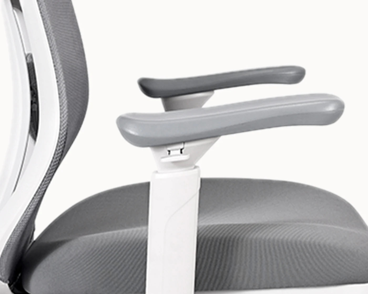 Close-up of the Flujo Pluto Ergonomic Chair’s adjustable armrest, showcasing ergonomic support for office environments in Singapore.