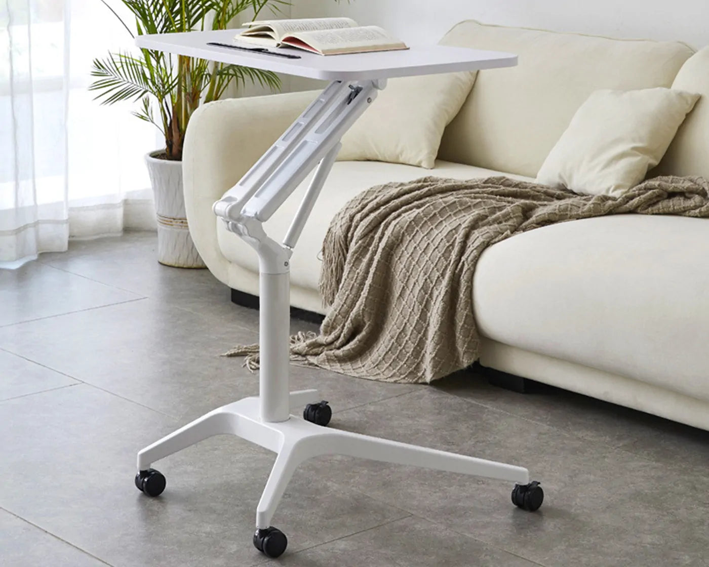 Height adjustable desk for small spaces with ergonomic design for home office and bedside use