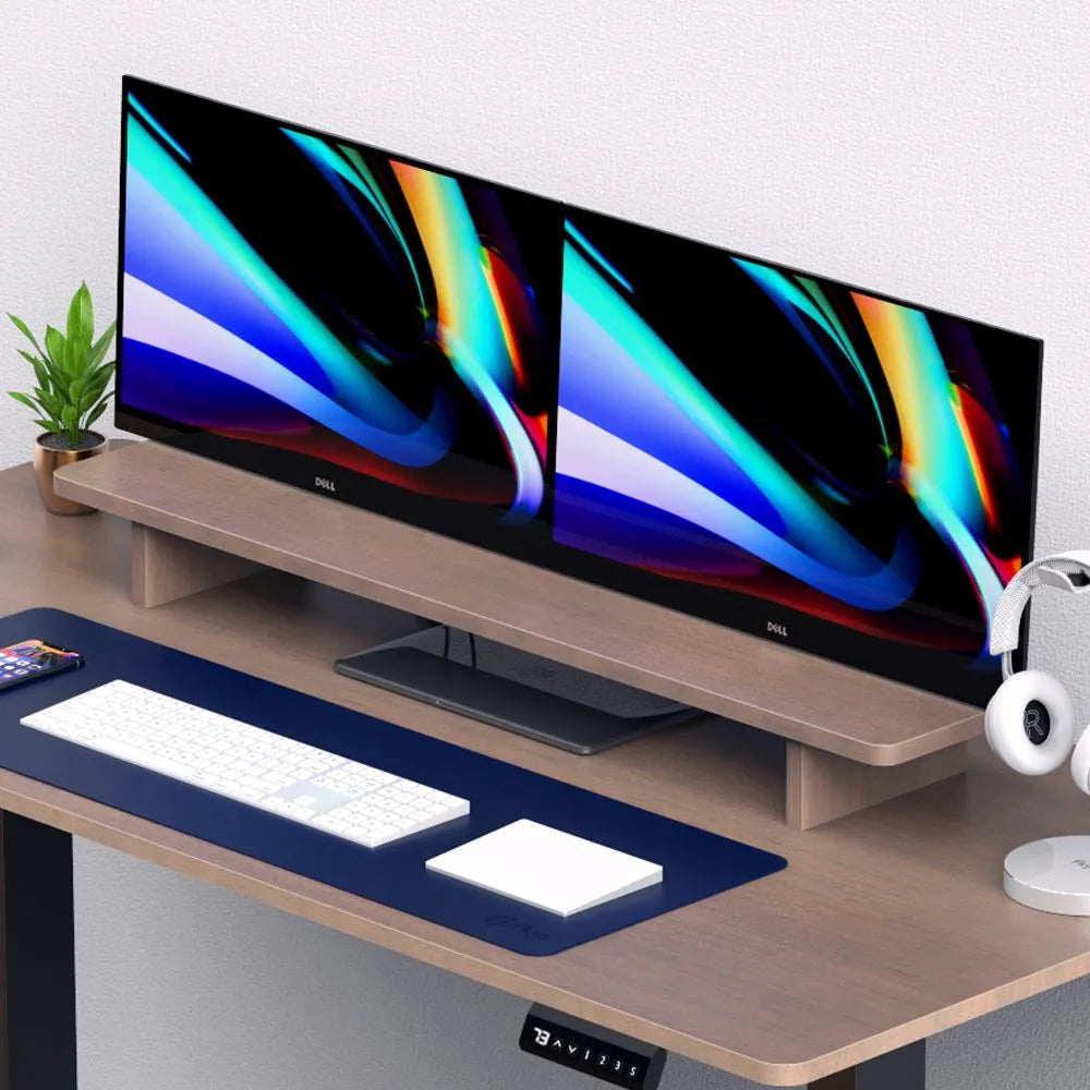 Modern dual-monitor setup on a wooden riser, showcasing an organized and ergonomic desk space in Singapore.