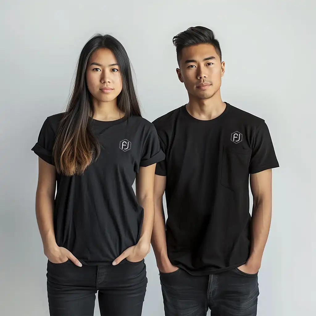 Two people wearing black t-shirts with a Flujo logo on the upper left side. The person on the left is a woman with long dark hair, and the person on the right is a man with short dark hair.