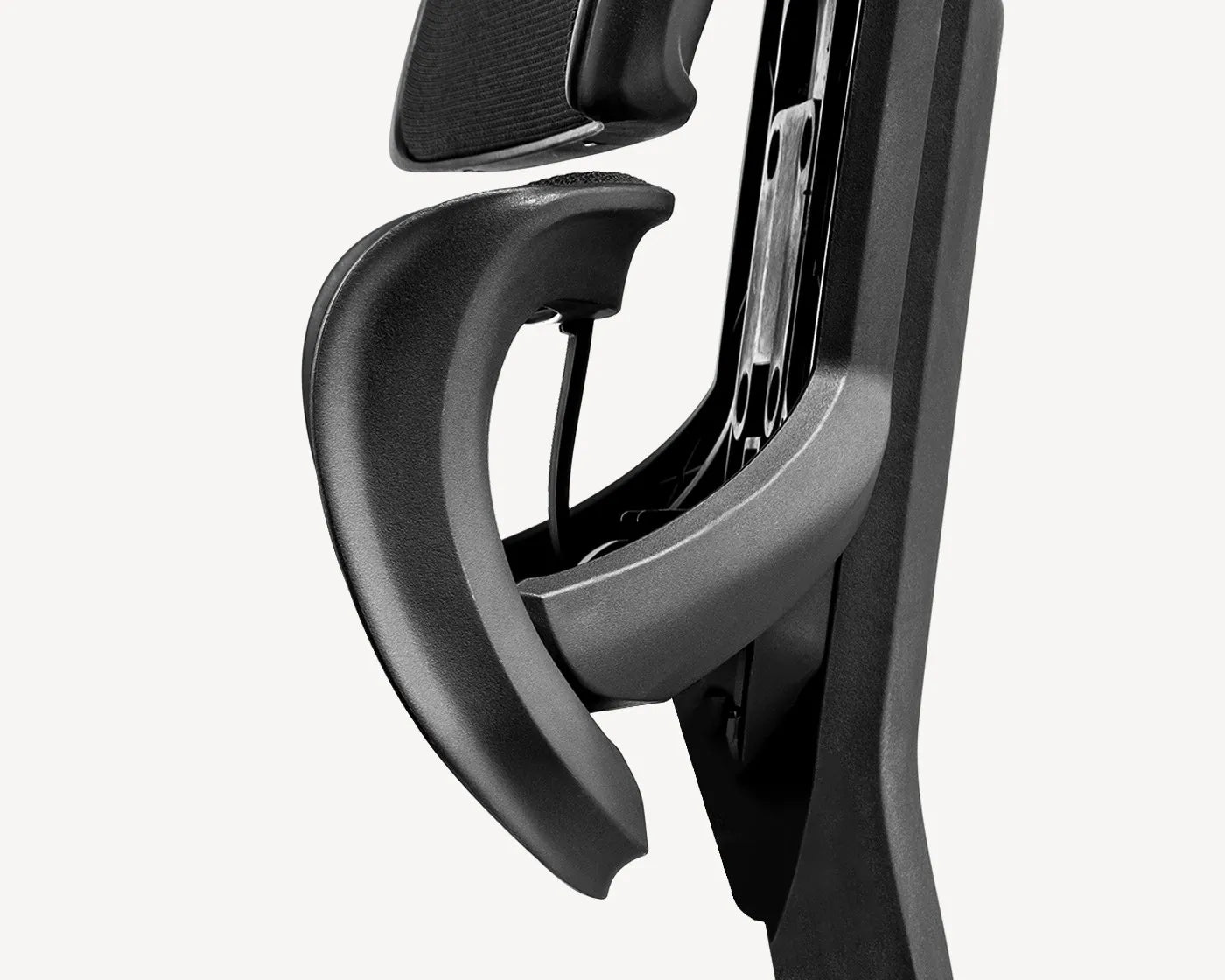Detail of Flujo chair's Vertebrae Assist armrest, designed for adaptive support and user comfort.