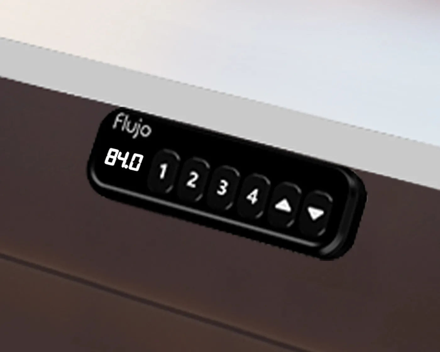 Detail of the Flujio SmarTrax Standing Desk's smart control panel with height range feature.