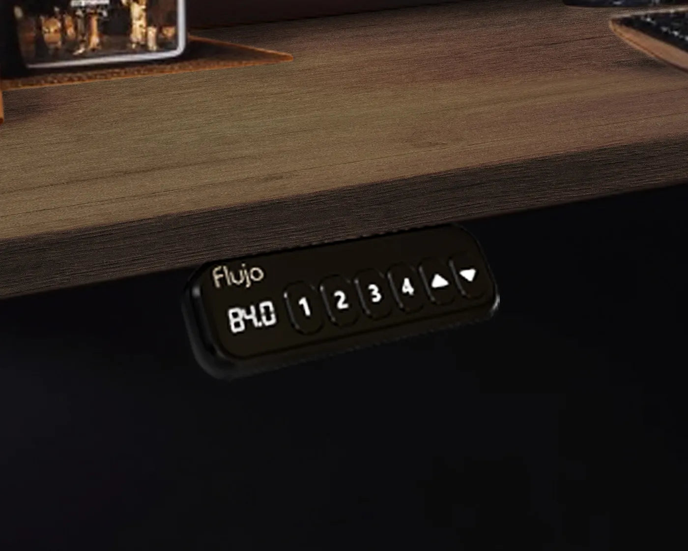 Close-up of the digital keypad control panel on Flujio SmartAxle Standing Desk with height presets.