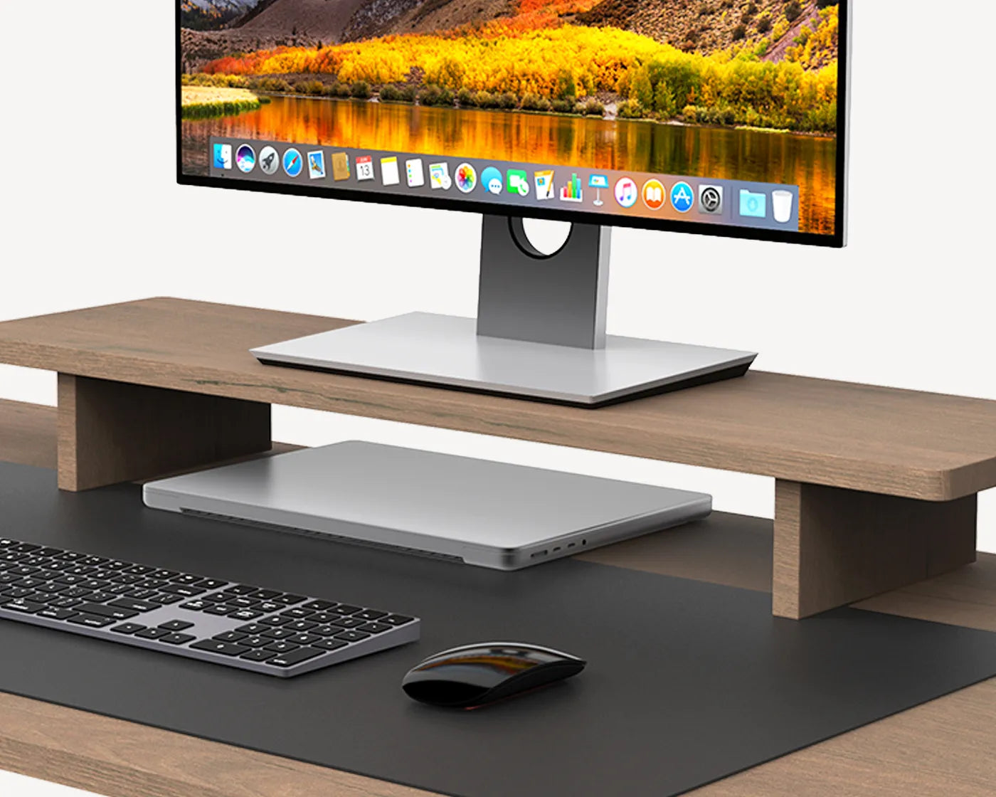An ergonomic wooden monitor riser on a desk, lifting a screen to eye level for improved posture and reduced strain