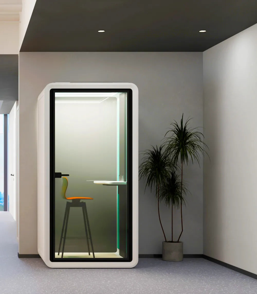 Flujo Acoustic Pod in a modern office setting, featuring a sleek and private space for focused work.