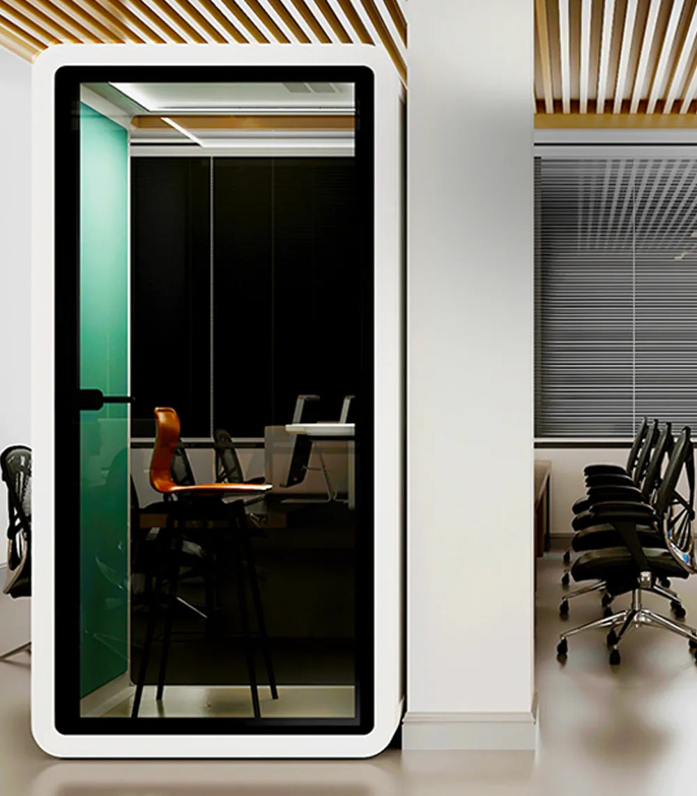 Flujo Acoustic Pod integrated into a contemporary office environment, providing a quiet space for meetings or work.