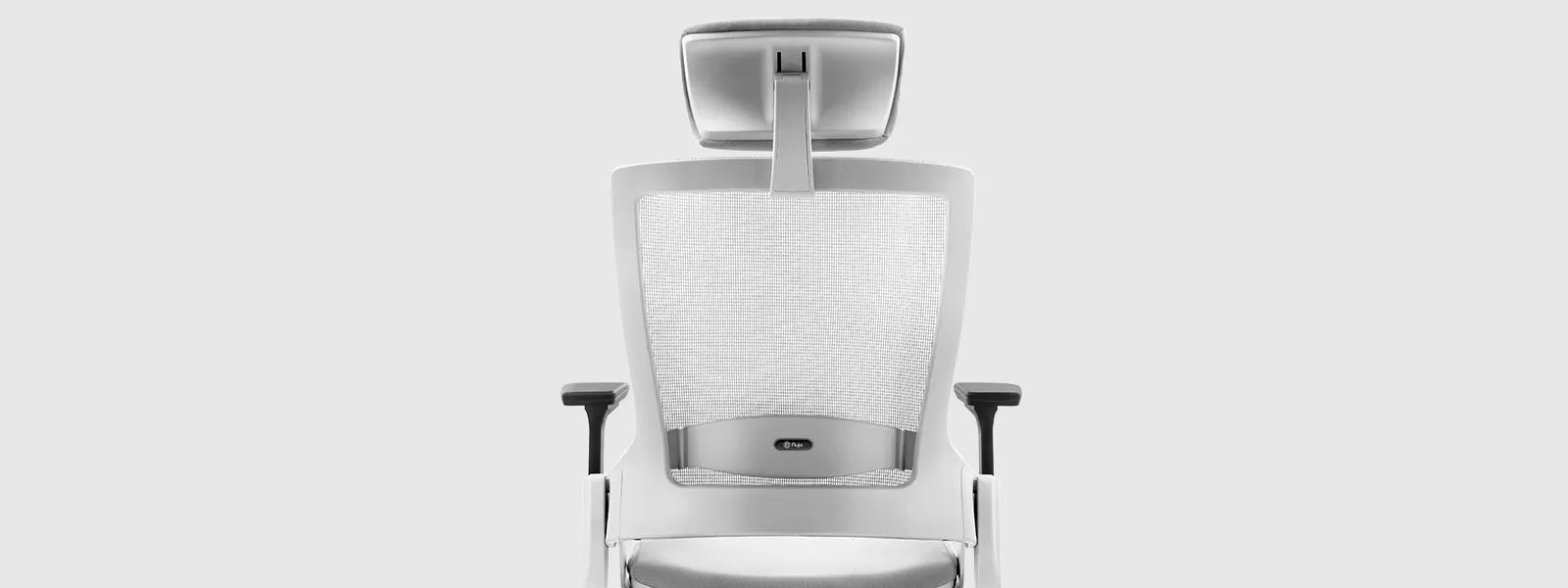 Detailed view of the Flujo Angulo Chair highlighting the adjustable headrest and mesh back design for optimal comfort.