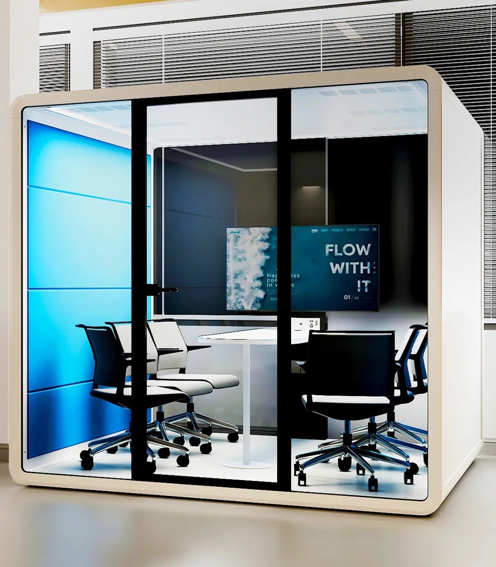 Flujo Hexa Meeting Pod in a modern office setup with sleek glass walls and ergonomic chairs, designed for private and productive meetings.