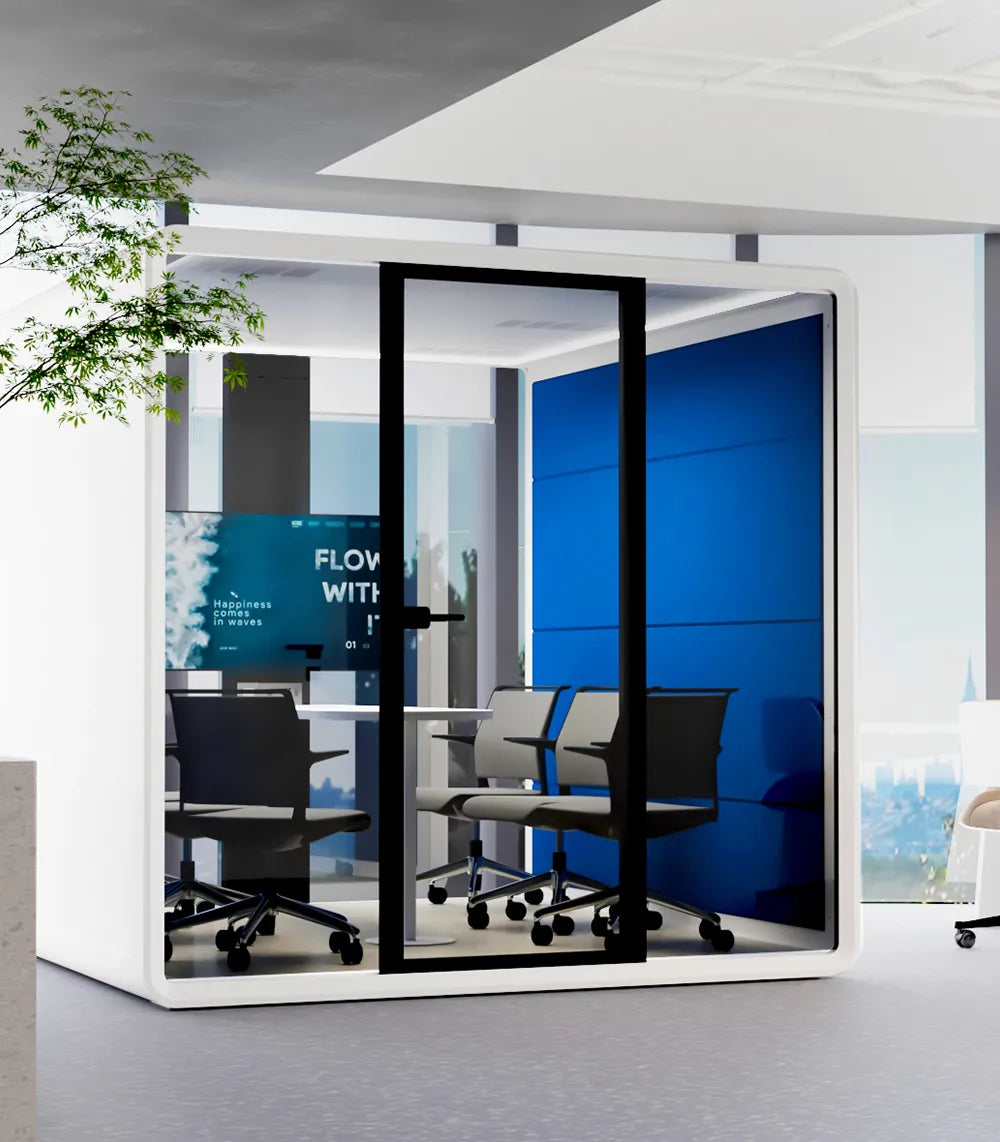 Flujo Hexa Meeting Pod situated in an open office environment, providing a private space with vibrant blue interiors for focused team discussions.