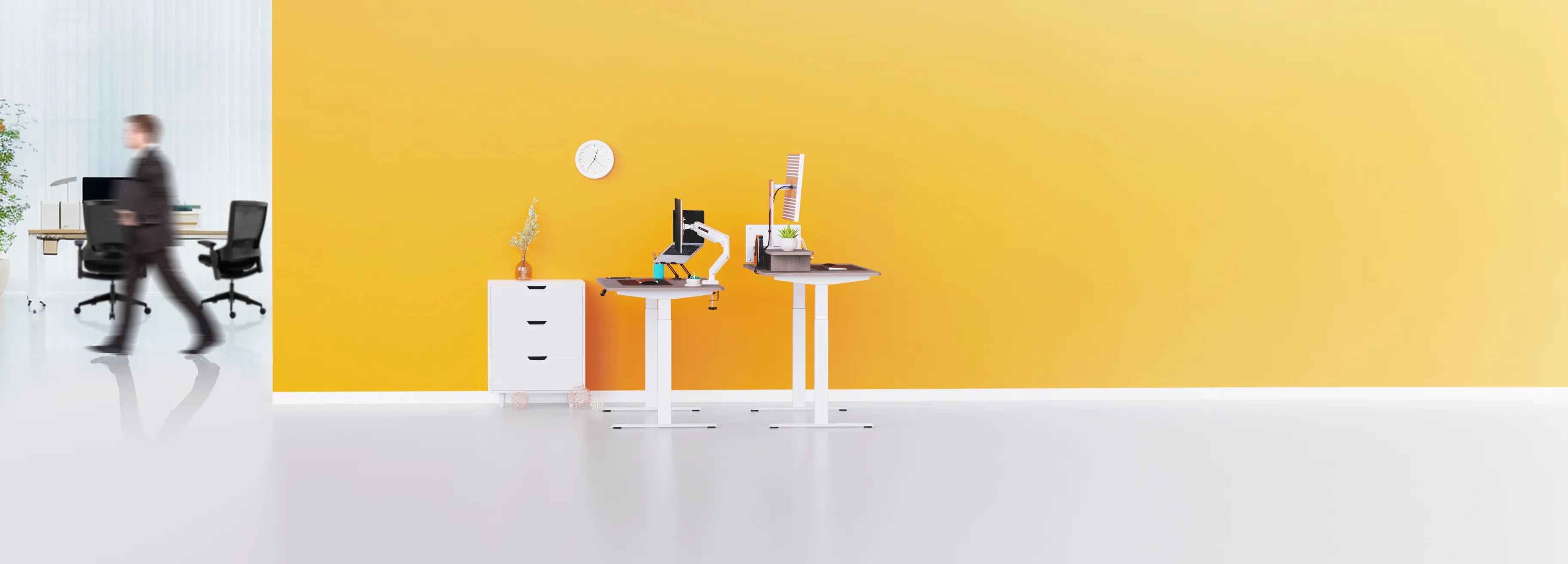 Flujo standing desks and office chairs in a contemporary workspace