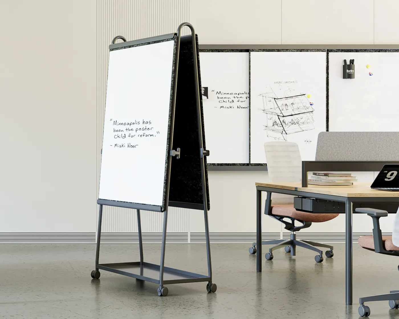 Flujo WriteDeck mobile whiteboard with dual-sided writing and magnetic functionality in a modern office setting.