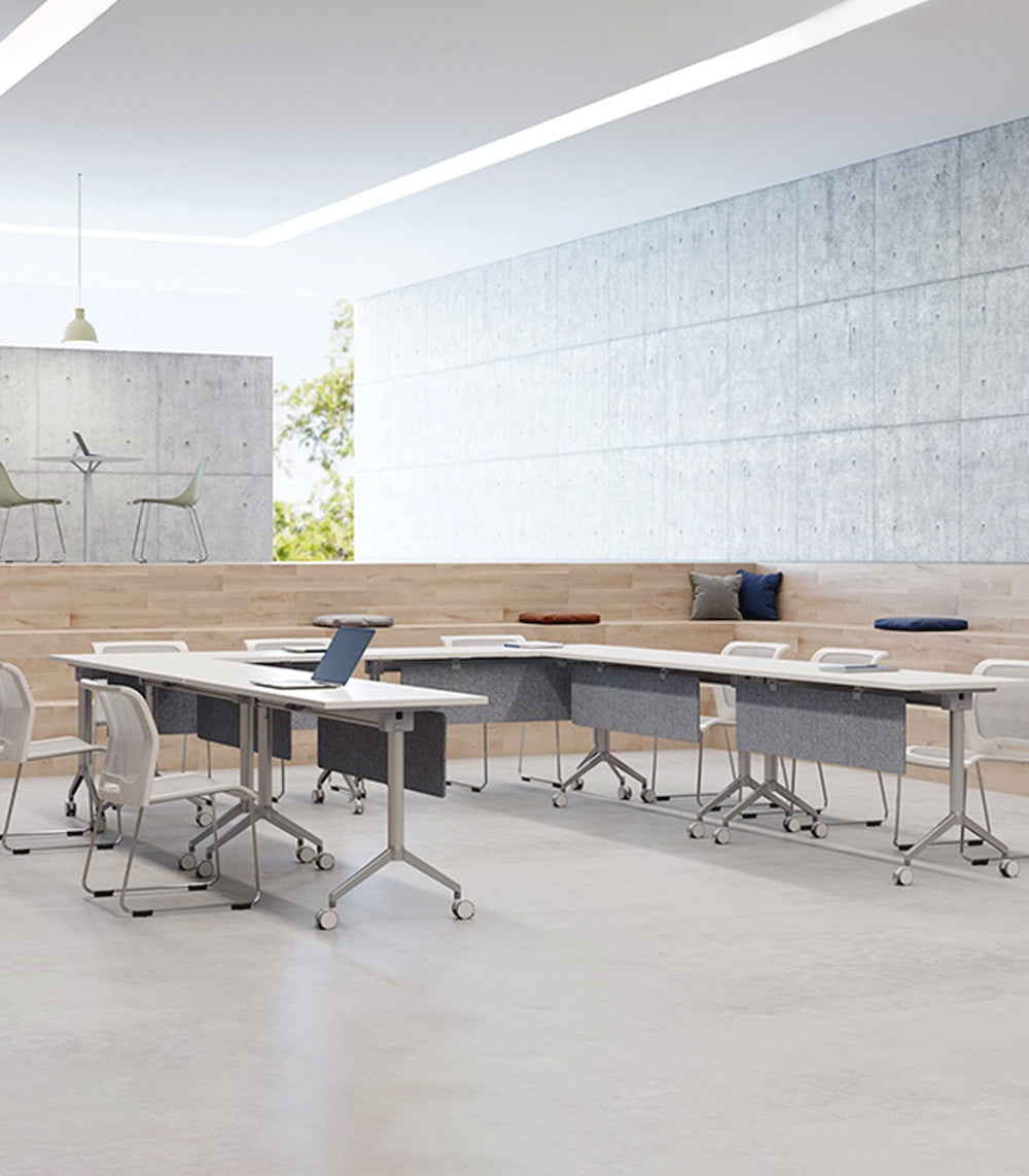 Training tables arranged for seminar and workshop setup in a modern training room